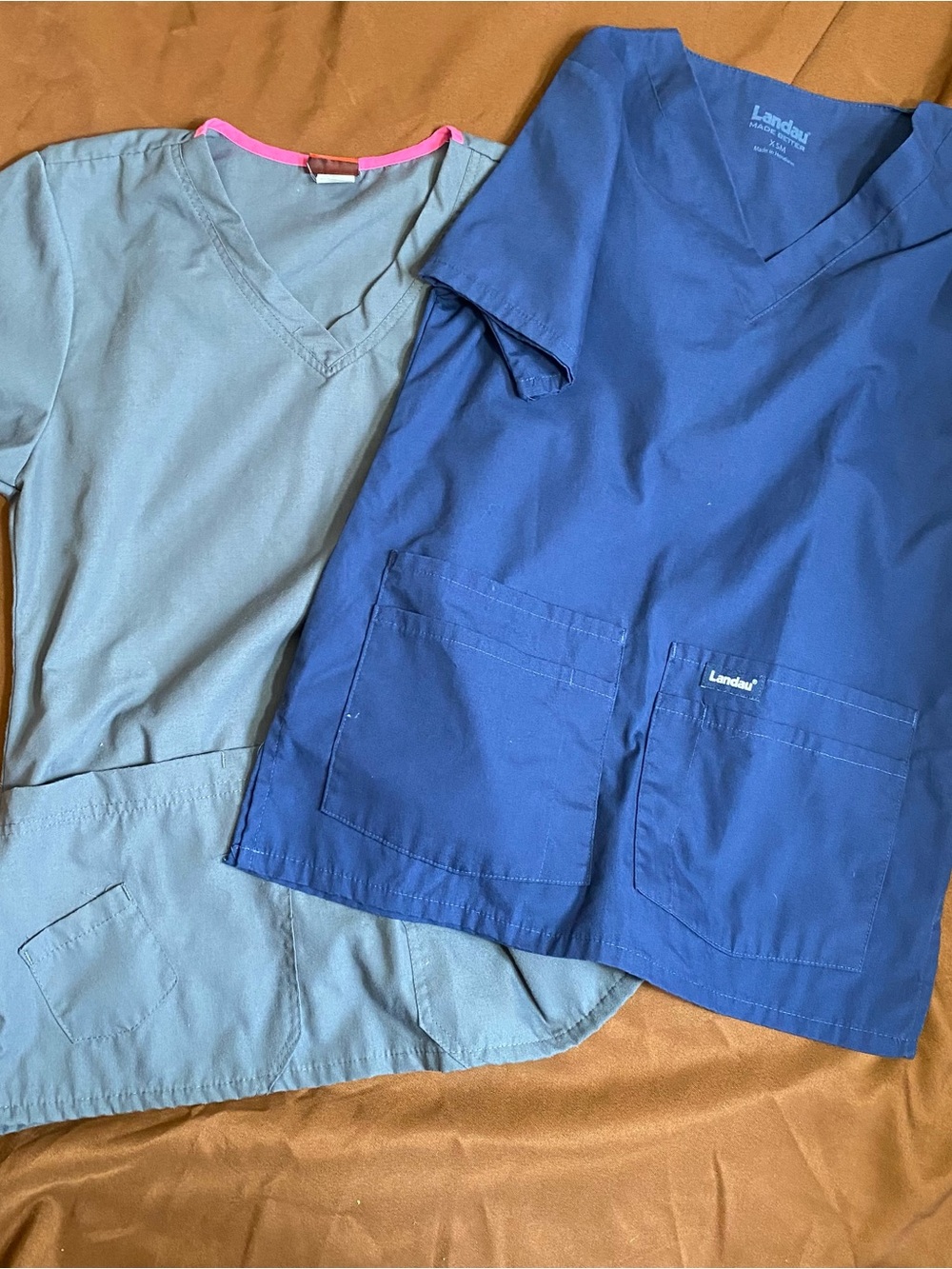 Two women’s scrub tops